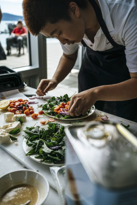 A student building a salad