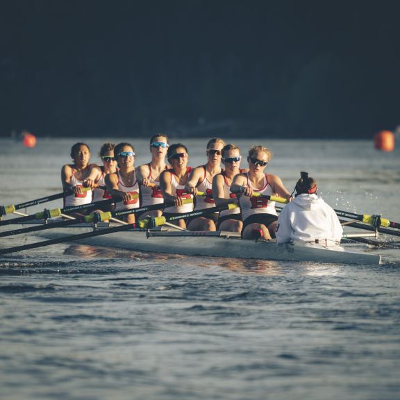 Girls' 8+ rowing in a race
