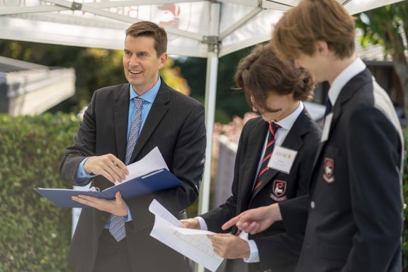 A house parent and students at the start of the school year